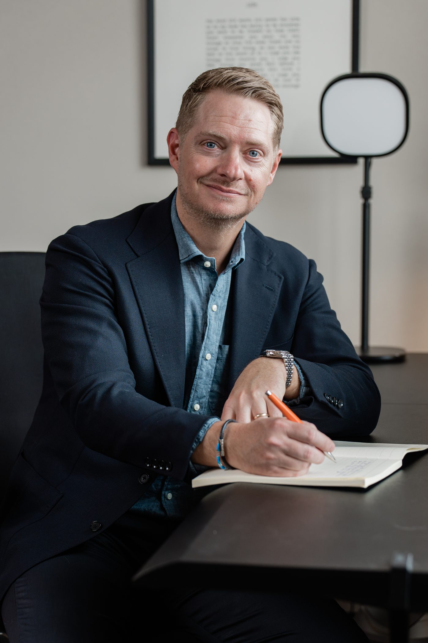 Jason VanRuler writing at his desk